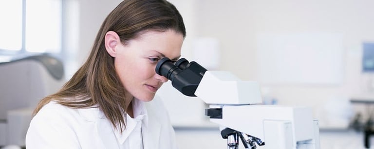 Scientist-looking-through-a-microscope.jpg